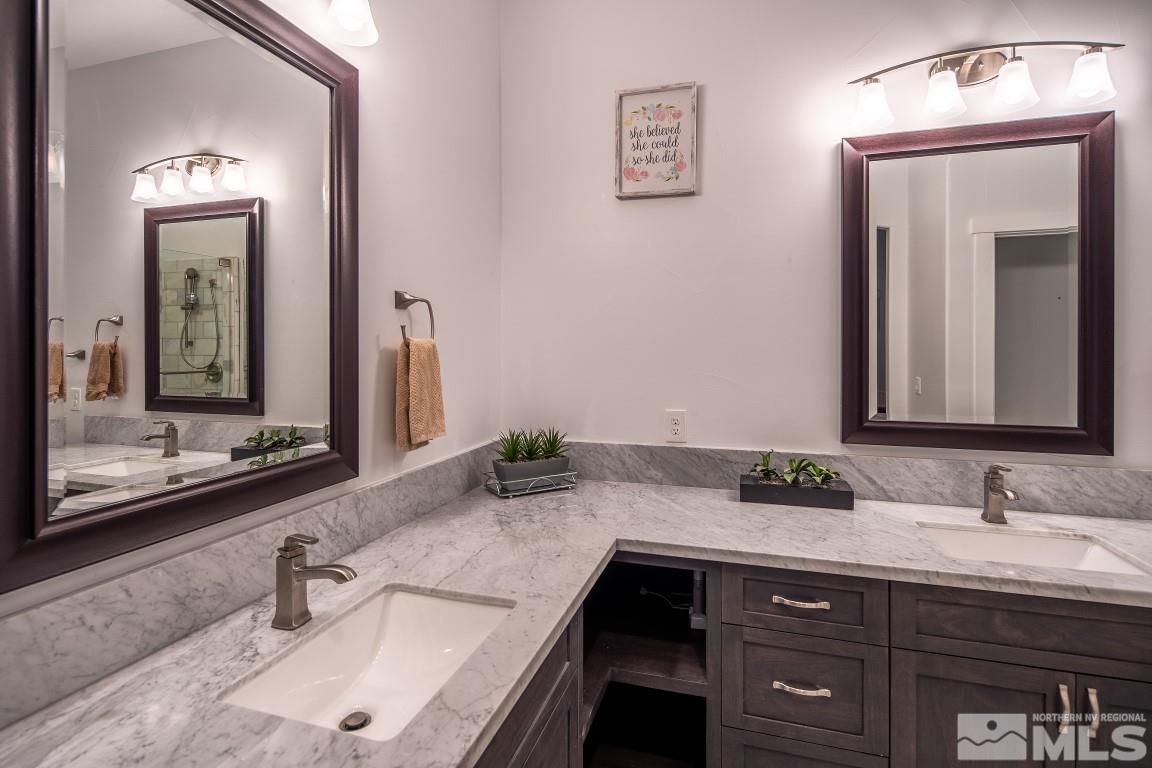 4610 Tybo Road Reno, NV 89521 - Photo 31 of 40 a bathroom with a sink and two mirror