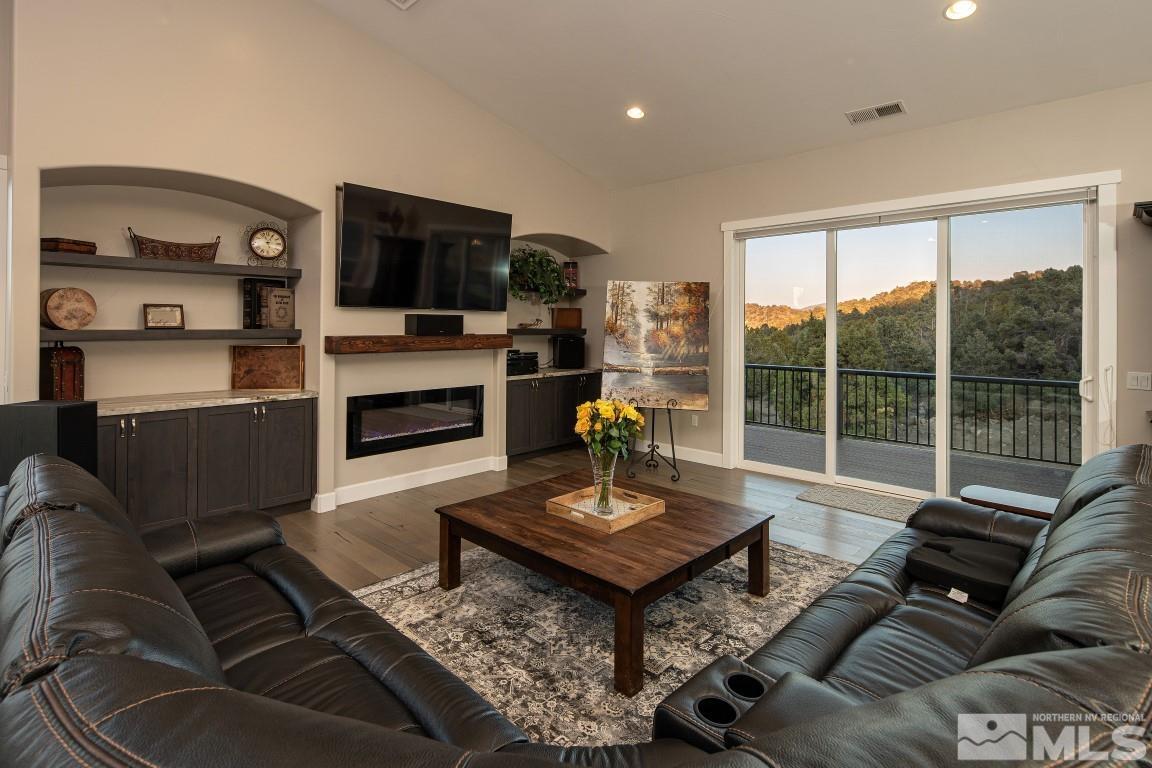 4610 Tybo Road Reno, NV 89521 - Photo 9 of 40 a living room with furniture wooden floor and a flat screen tv