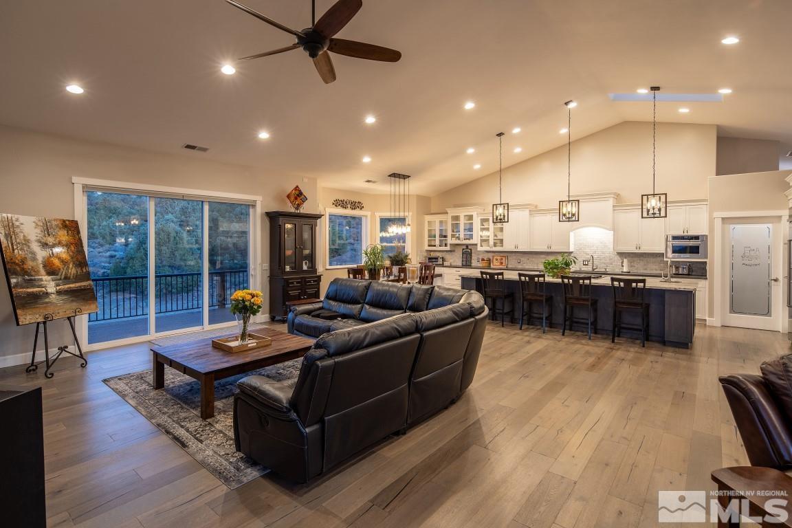 4610 Tybo Road Reno, NV 89521 - Photo 10 of 40 a living room with lots of furniture and kitchen view