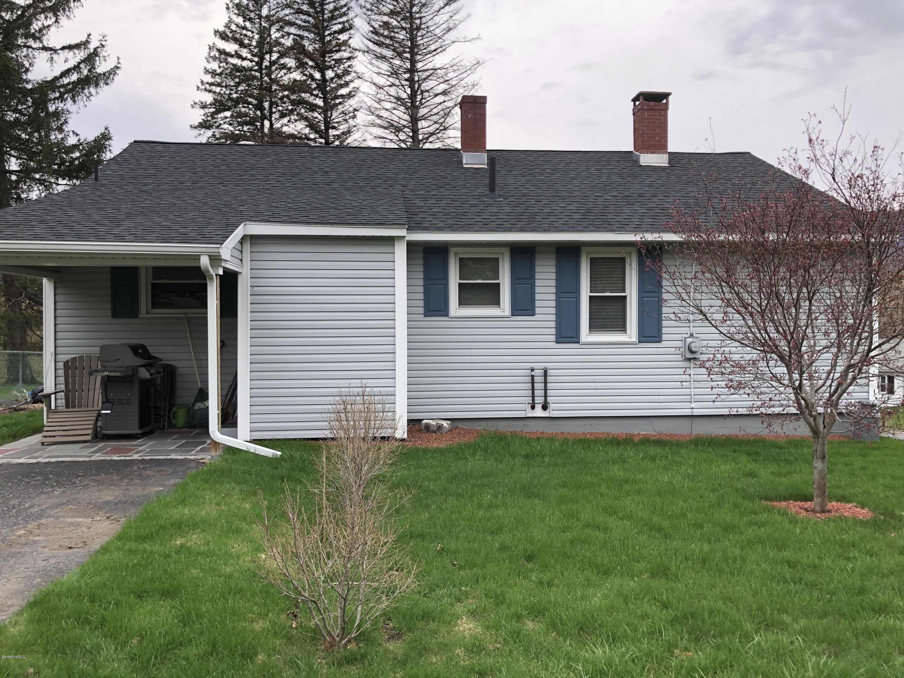 235 East Road Adams, MA 01220 - Photo 2 of 15 a front view of house with yard and trees in the background