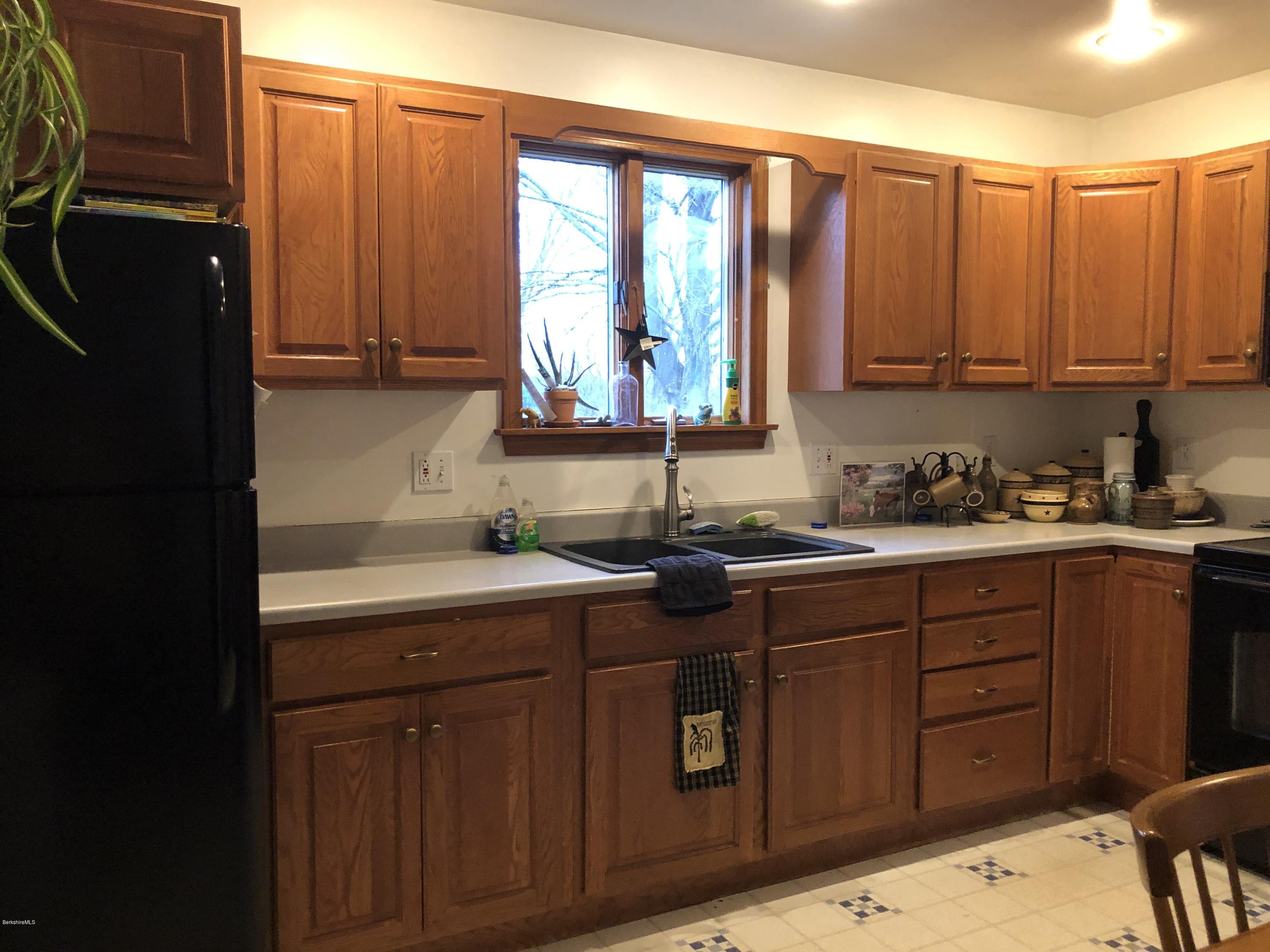 235 East Road Adams, MA 01220 - Photo 4 of 15 a kitchen with stainless steel appliances granite countertop a refrigerator and sink
