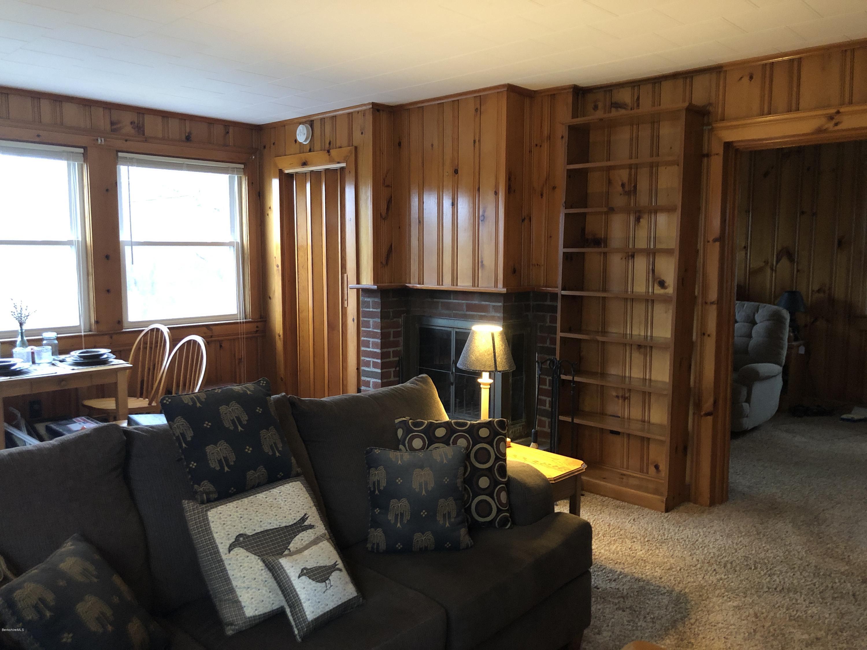 235 East Road Adams, MA 01220 - Photo 8 of 15 a living room with furniture and a fireplace