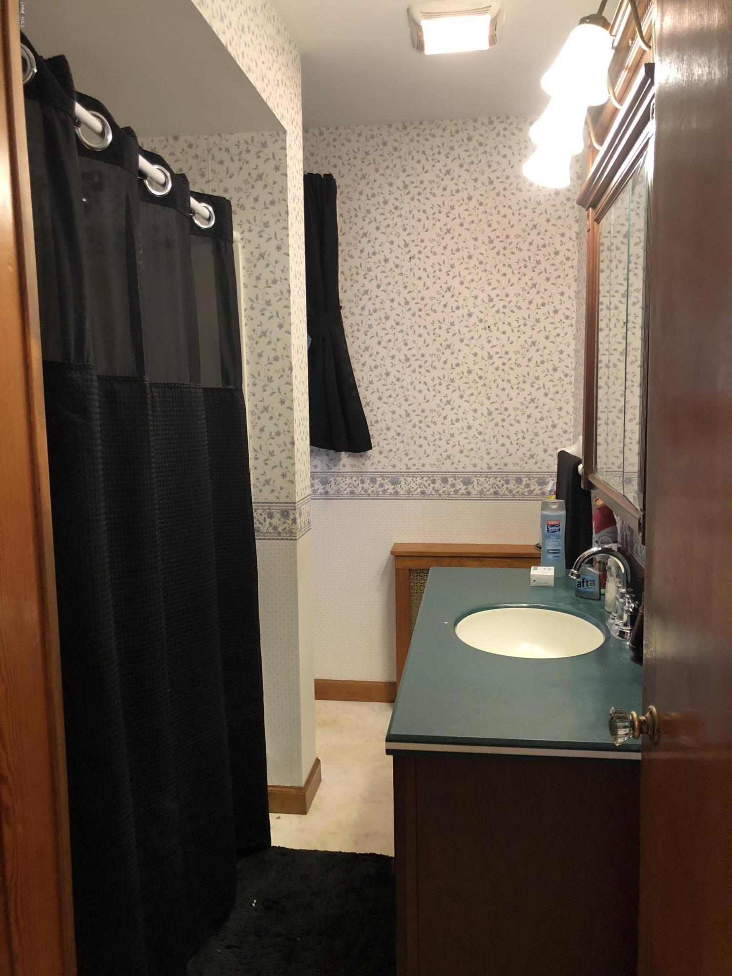 235 East Road Adams, MA 01220 - Photo 10 of 15 a bathroom with a sink and a mirror