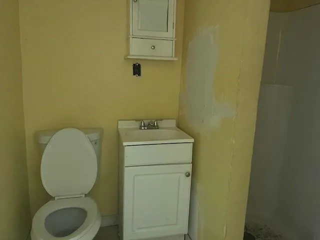 a bathroom with a toilet and a sink