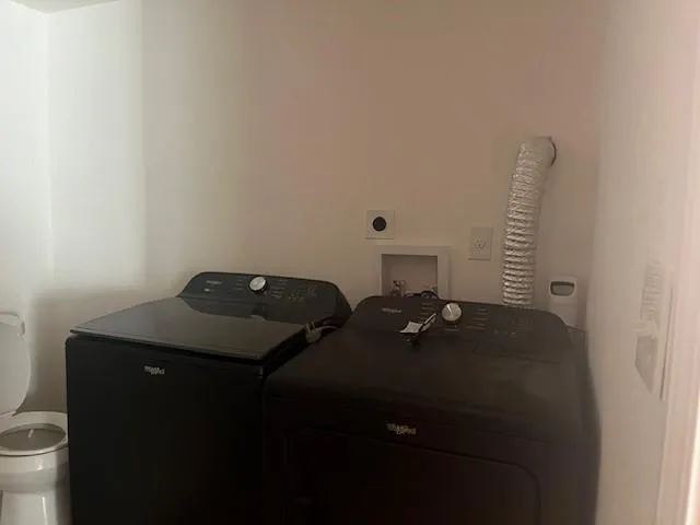 a bathroom with a bathtub and toilet