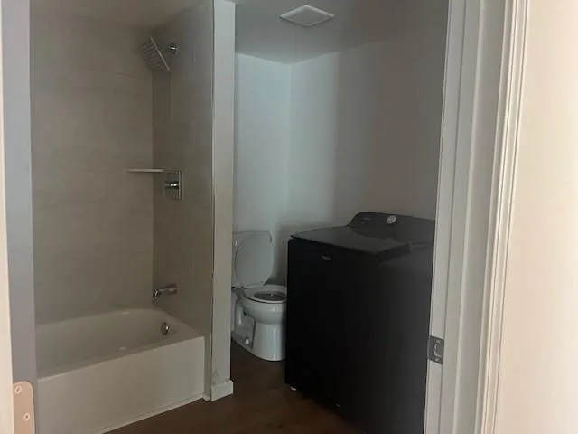 a bathroom with a bathtub and a sink