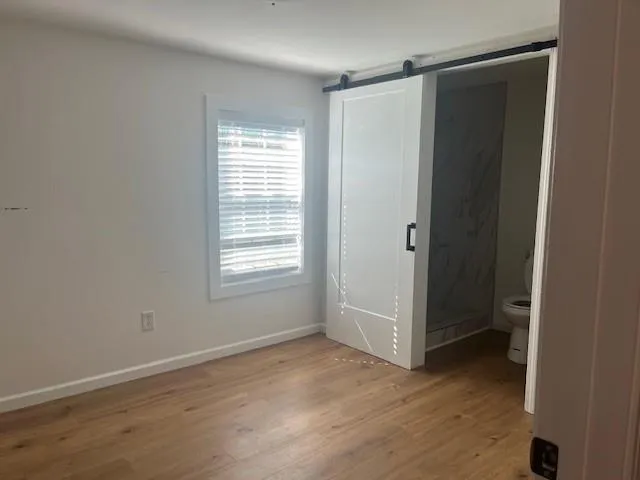a bathroom with a glass shower door