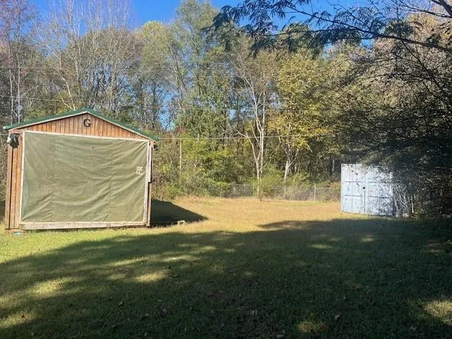 a view of a back yard of the house
