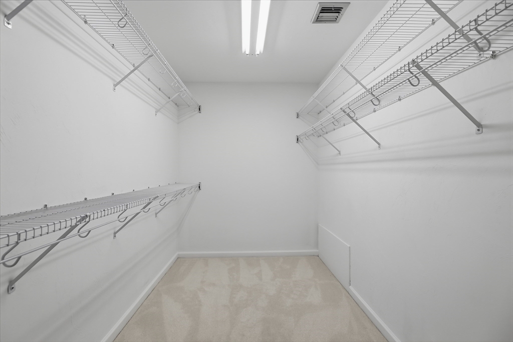61 Indian Head Road Framingham, MA 01701 - Photo 27 of 42 a view of storage and utility room with racks on the wall