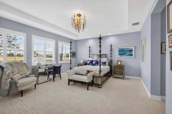 a bedroom with a bed and a couch