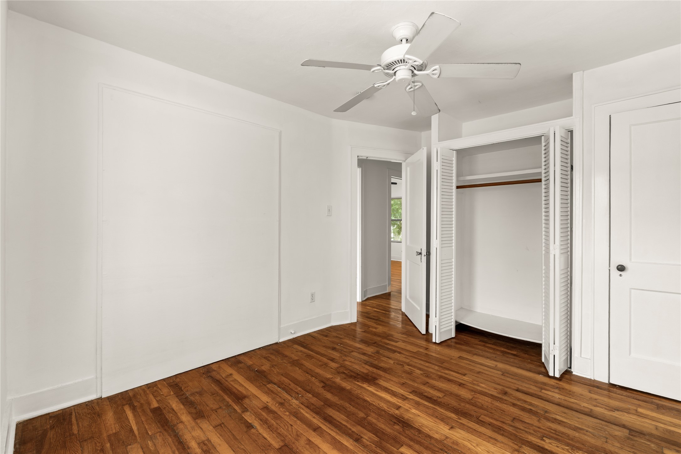 2202 West Main Street Houston, TX 77098 - Photo 24 of 32 wooden floor in an empty room
