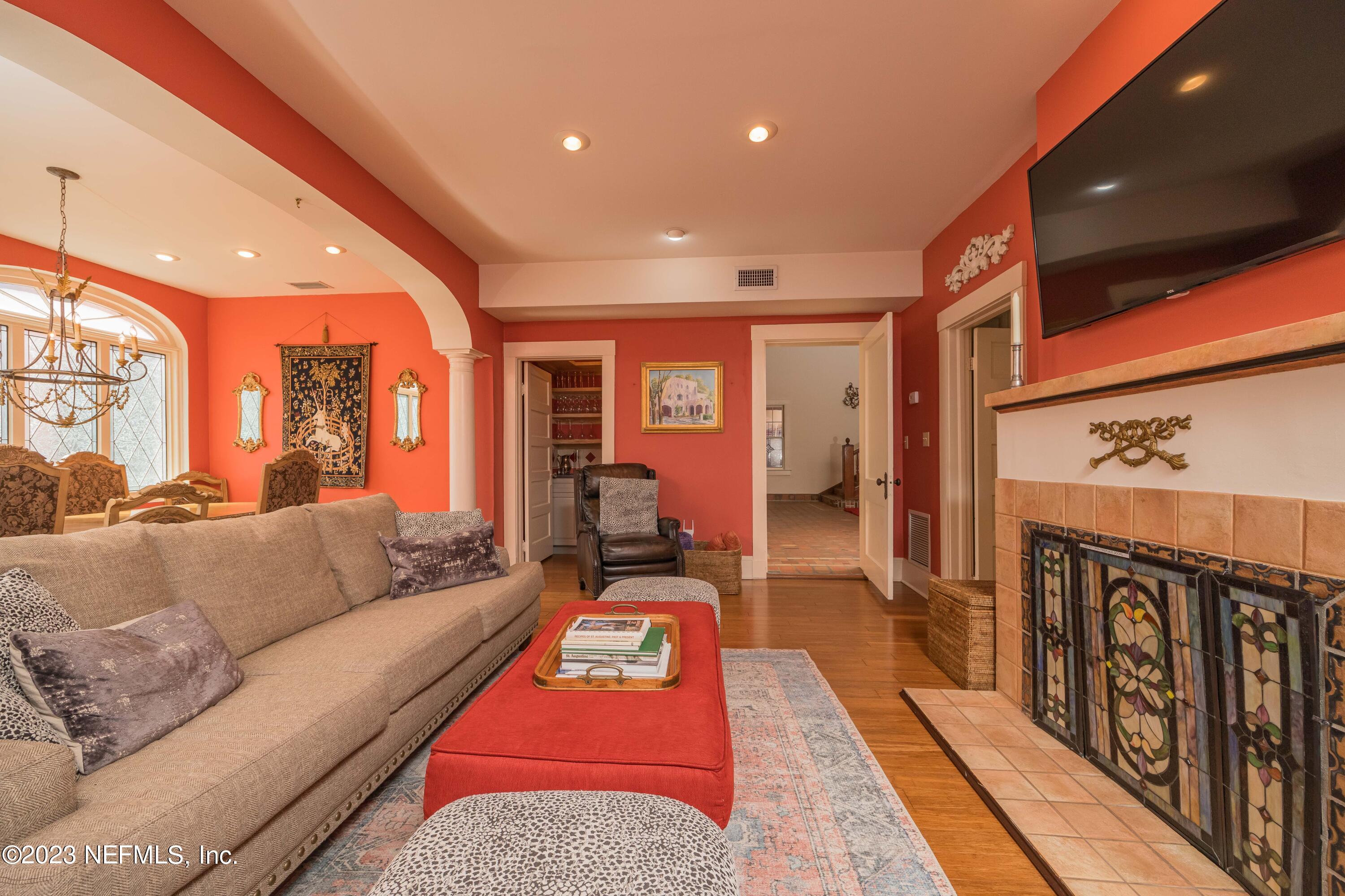 16 May Street St. Augustine, FL 32084 - Photo 16 of 86 a living room with furniture a rug and a fireplace