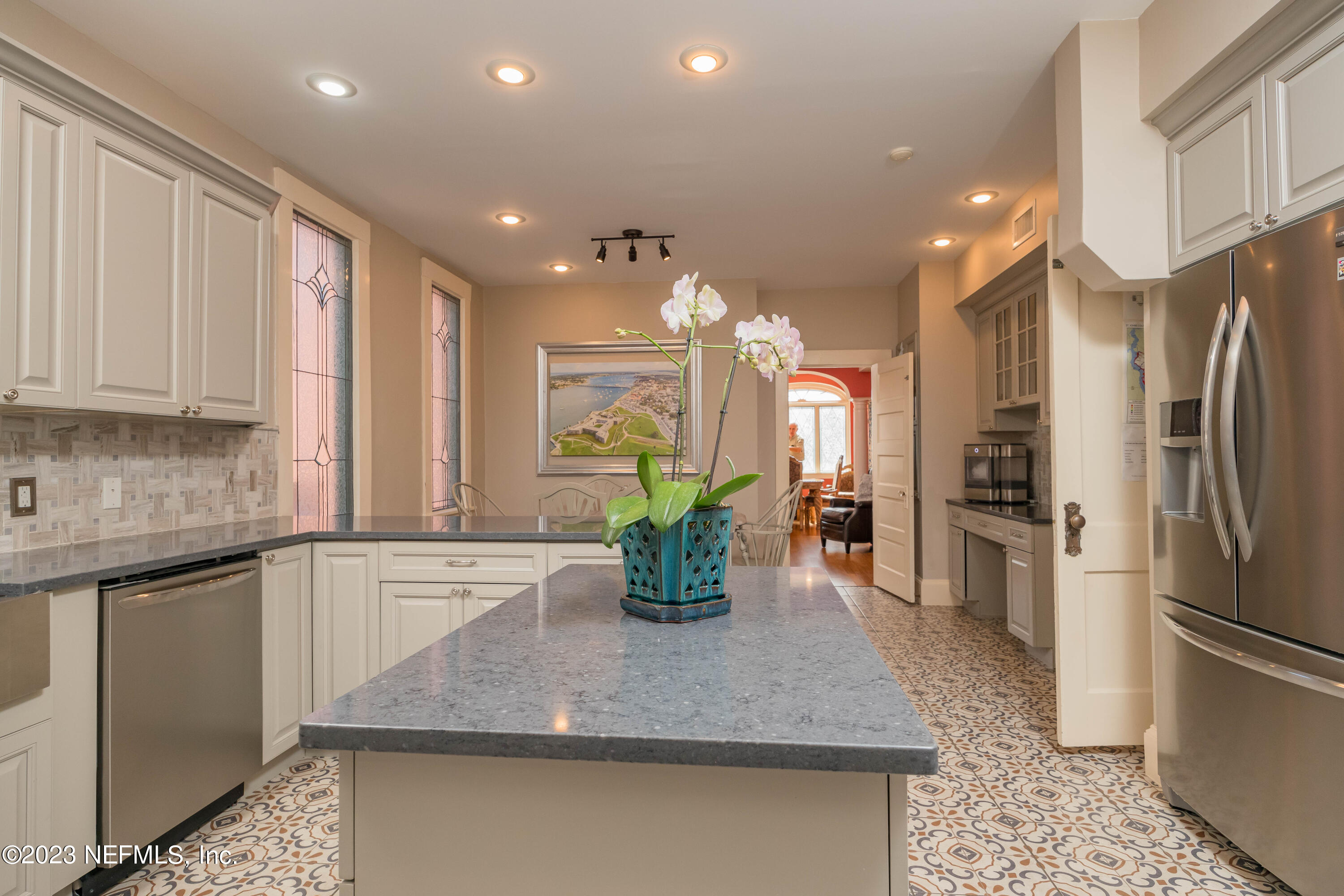 16 May Street St. Augustine, FL 32084 - Photo 29 of 86 a kitchen with stainless steel appliances granite countertop a refrigerator and a sink