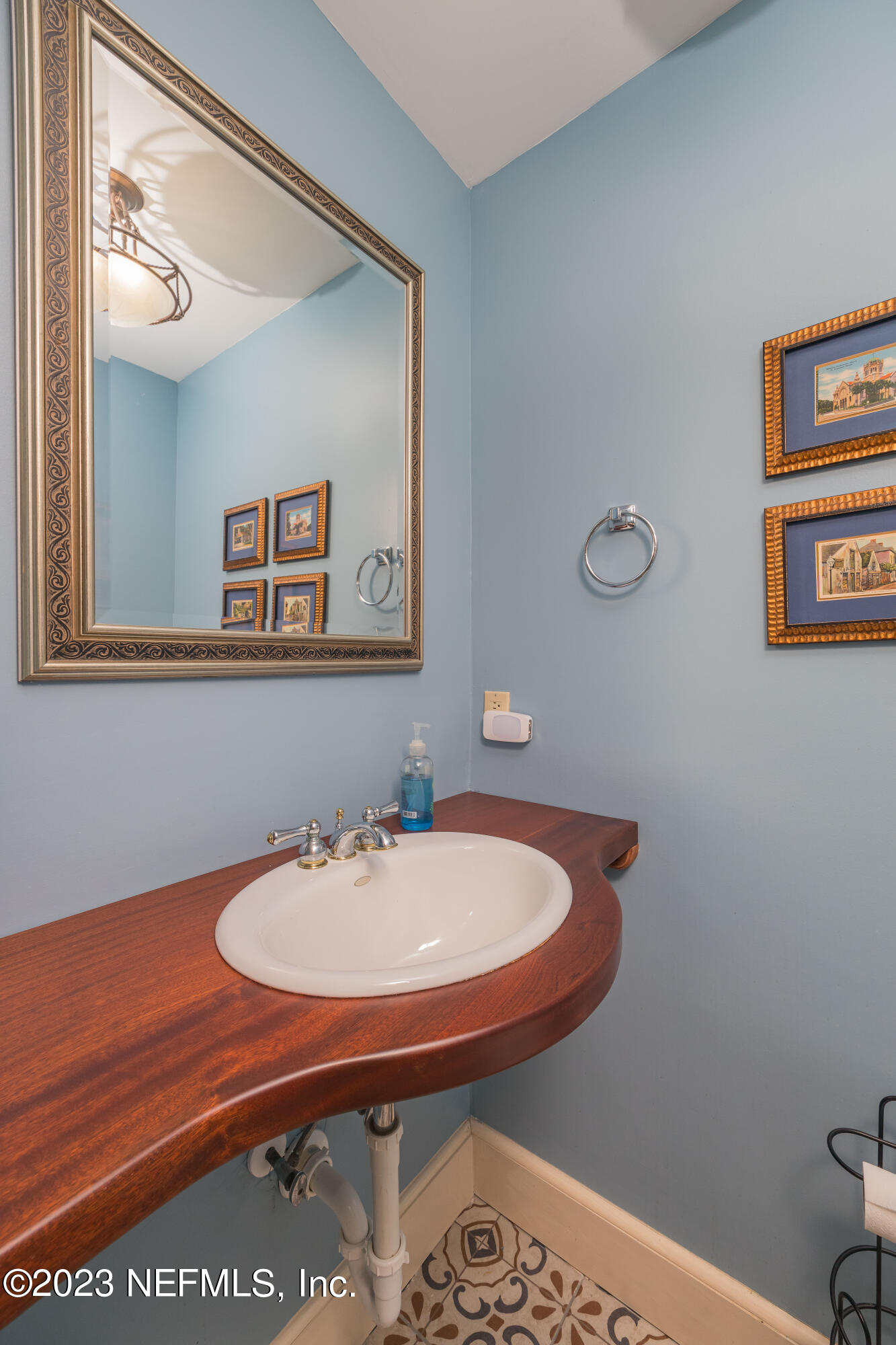 16 May Street St. Augustine, FL 32084 - Photo 34 of 86 a bathroom with a sink and a mirror
