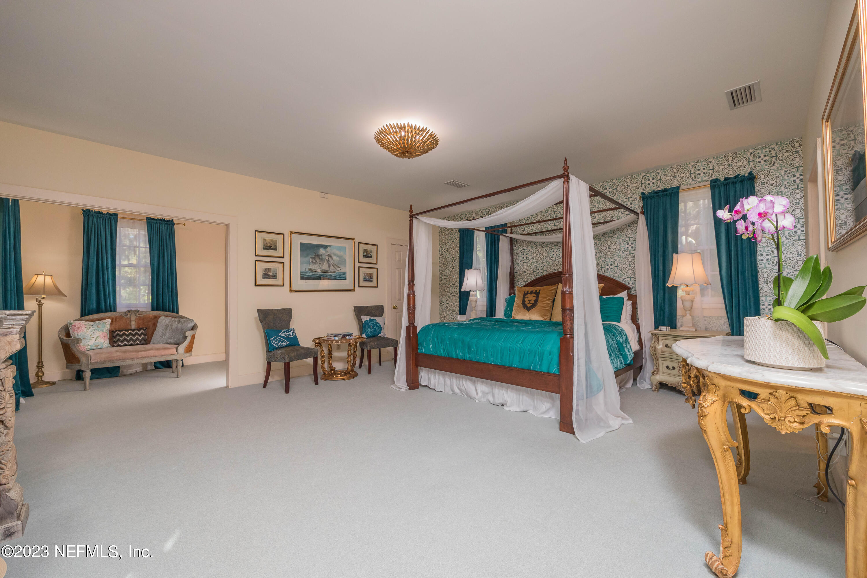 16 May Street St. Augustine, FL 32084 - Photo 43 of 86 a bedroom with furniture and a potted plant