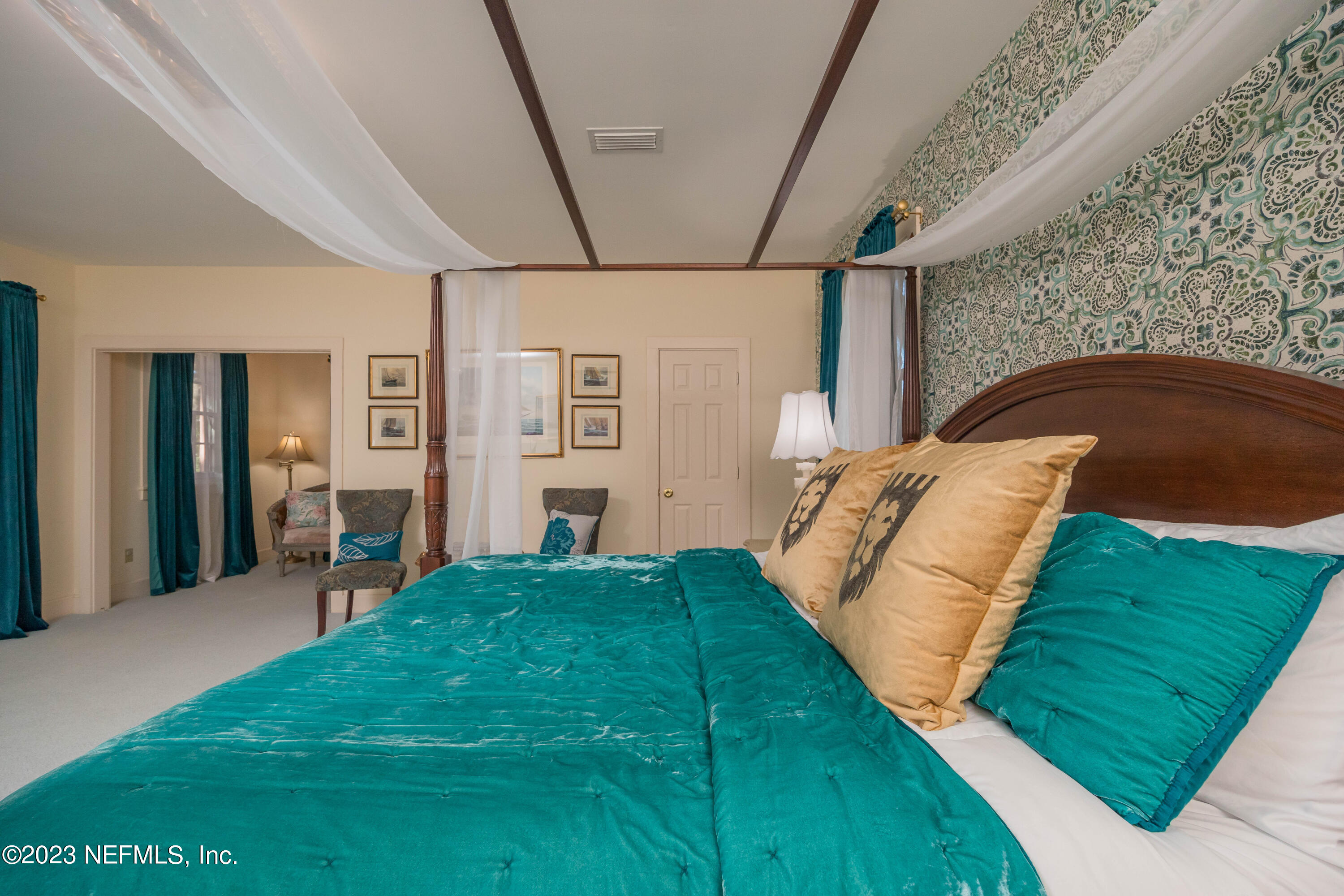 16 May Street St. Augustine, FL 32084 - Photo 44 of 86 a bedroom with a bed and a view of living room