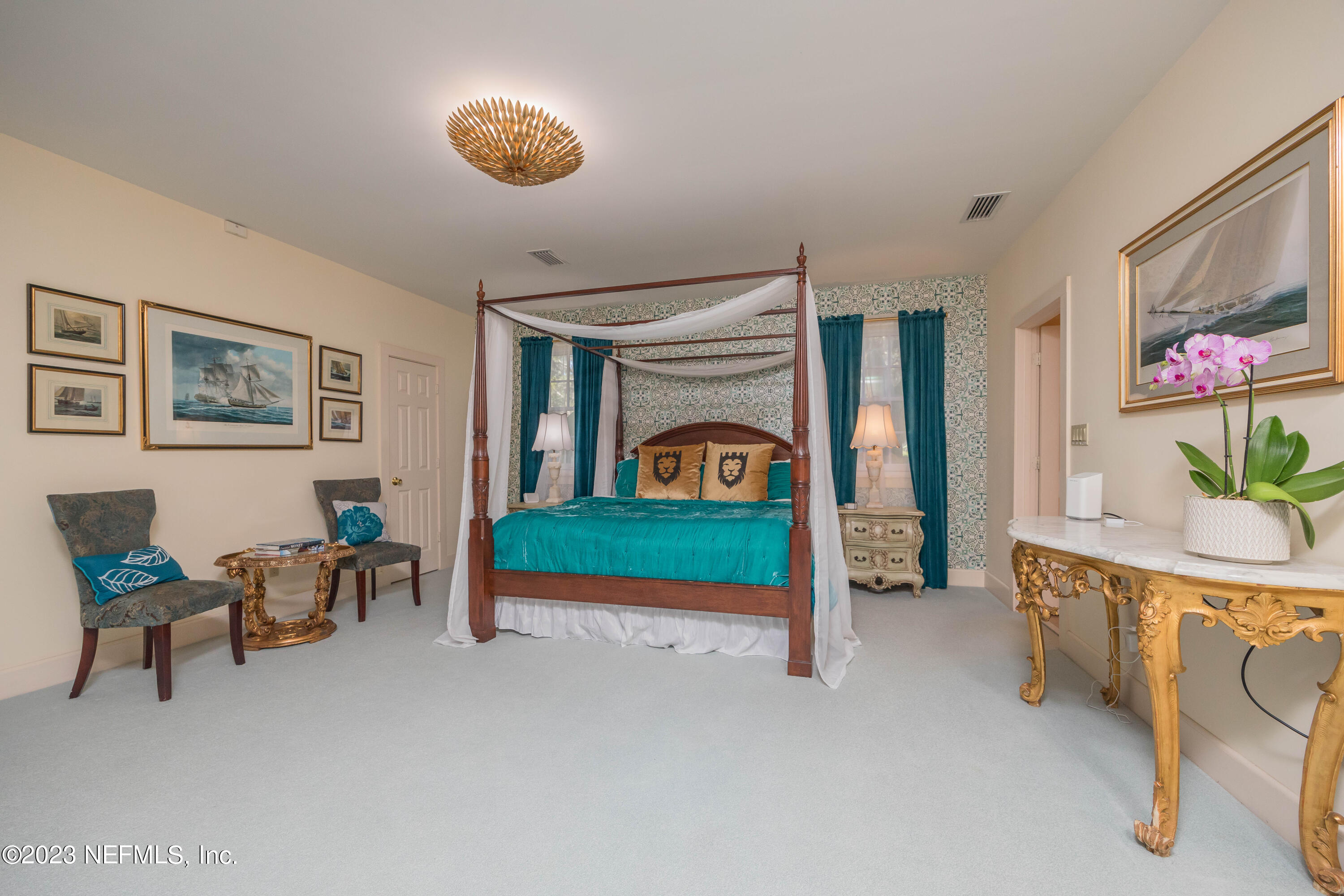 16 May Street St. Augustine, FL 32084 - Photo 45 of 86 a bedroom with furniture and a lamp