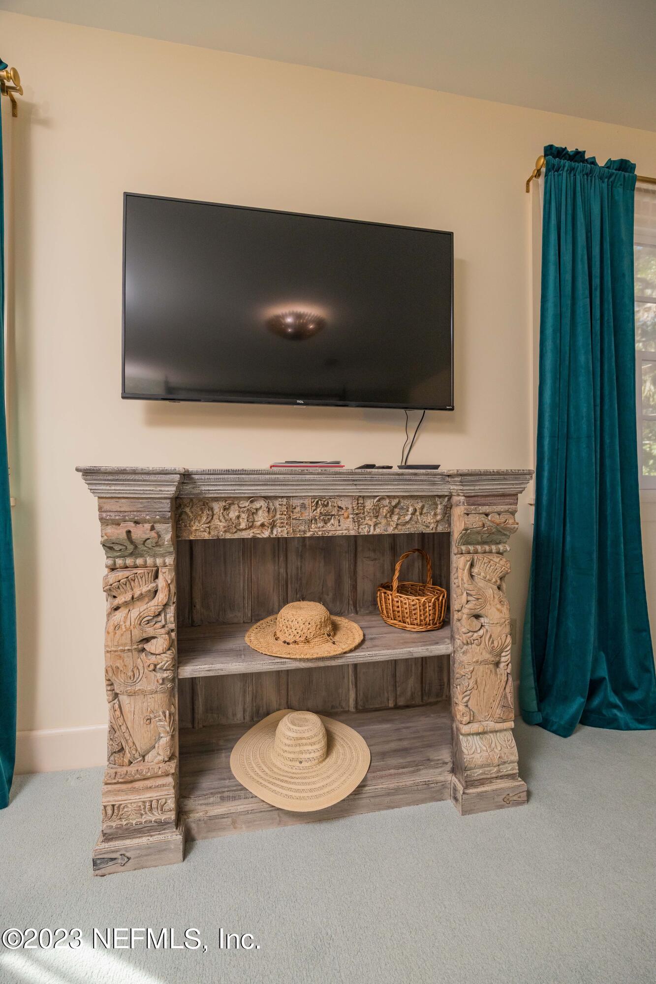 16 May Street St. Augustine, FL 32084 - Photo 47 of 86 a living room with furniture and a flat screen tv