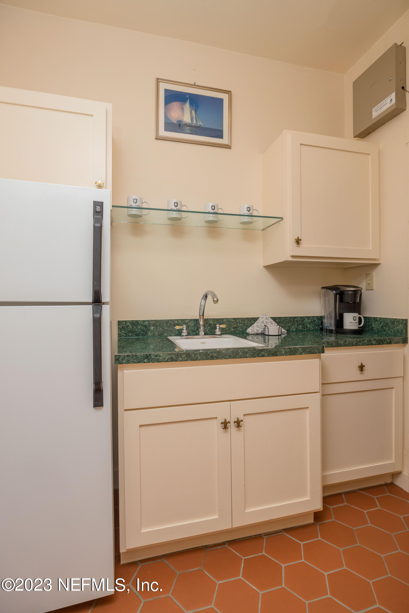 16 May Street St. Augustine, FL 32084 - Photo 57 of 86 a kitchen with stainless steel appliances granite countertop a refrigerator and a stove