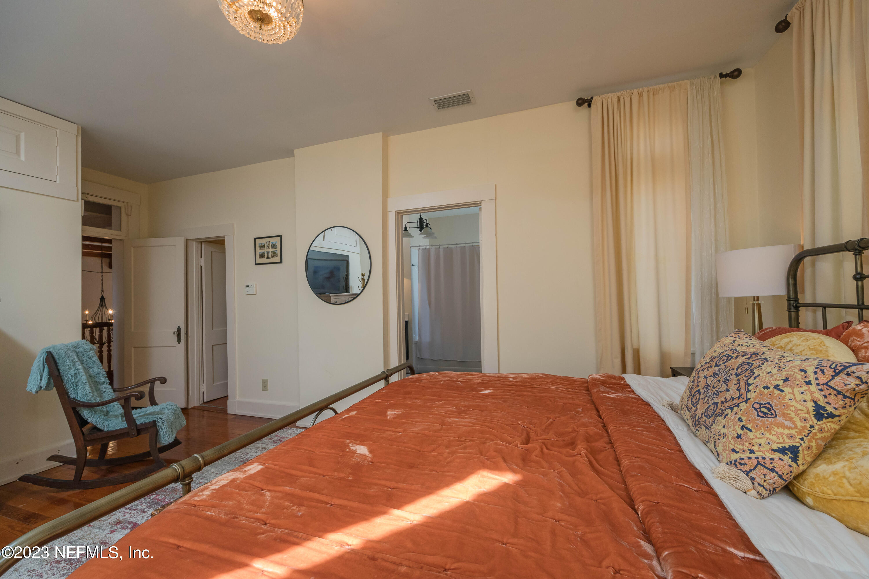 16 May Street St. Augustine, FL 32084 - Photo 59 of 86 a bedroom with a bed and a mirror