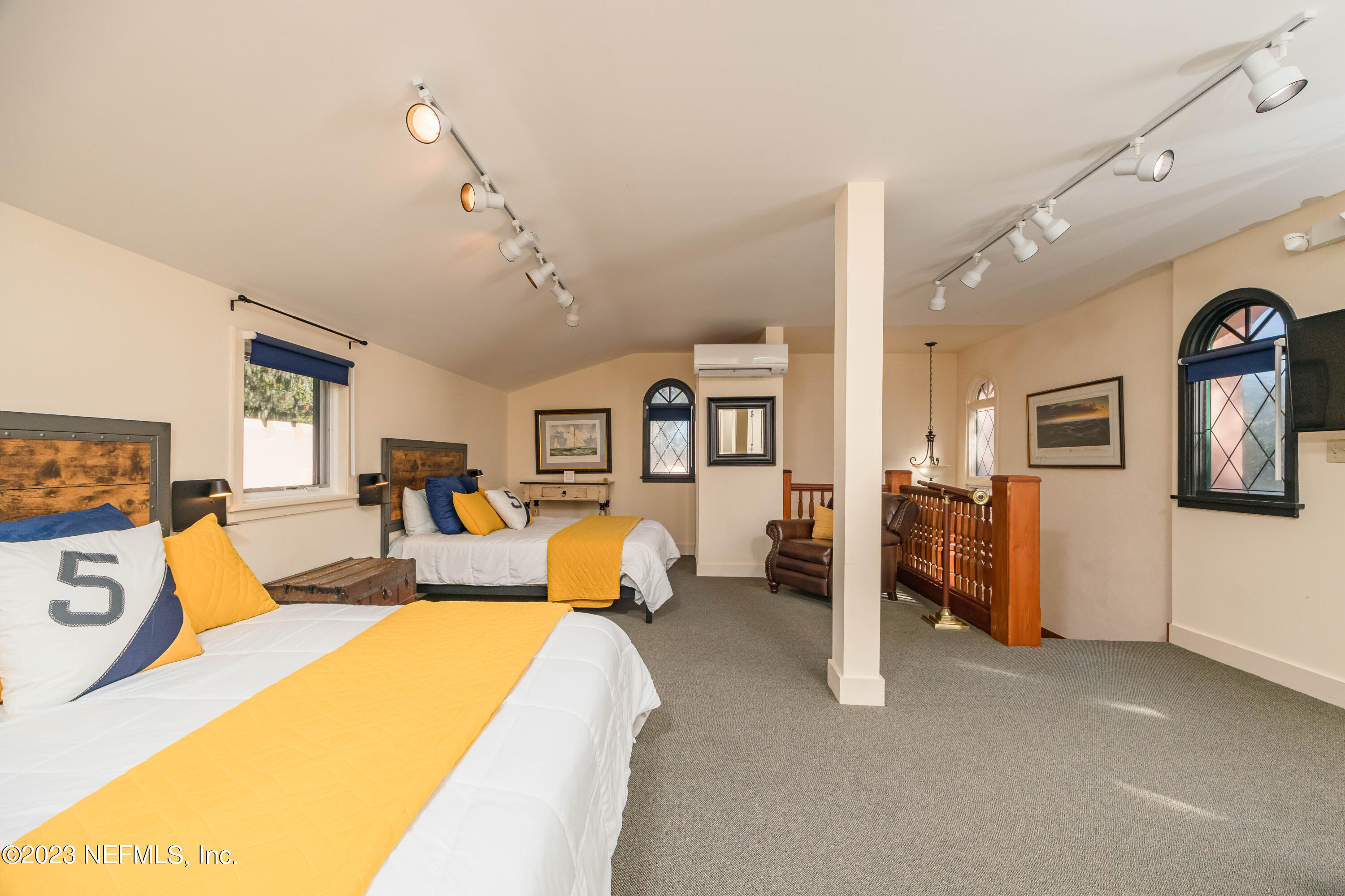 16 May Street St. Augustine, FL 32084 - Photo 66 of 86 a living room with furniture and a flat screen tv