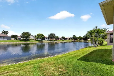a view of a lake with a yard