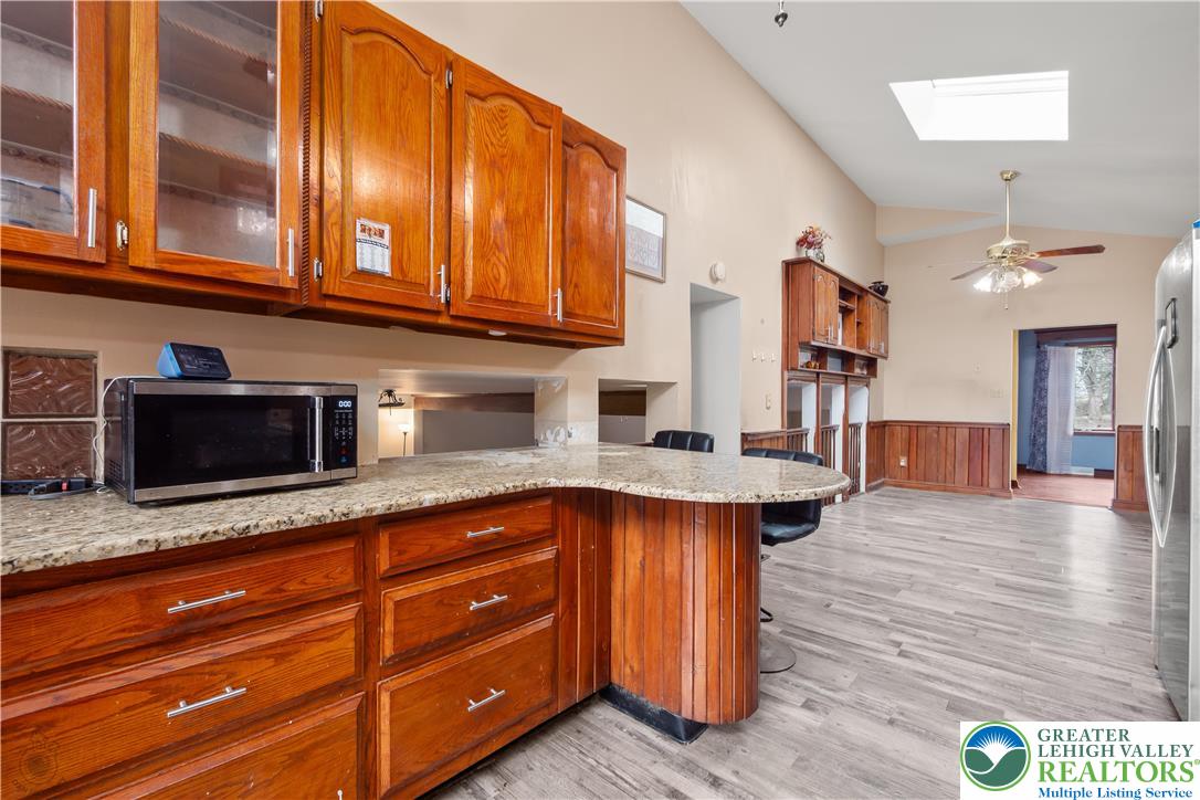 120 Royal Manor Road Easton, PA 18042 - Photo 12 of 49 a kitchen with stainless steel appliances granite countertop cabinets and wooden floor