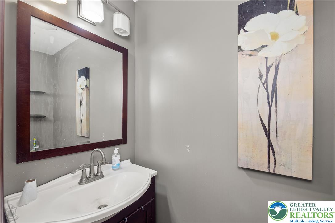 120 Royal Manor Road Easton, PA 18042 - Photo 15 of 49 a bathroom with a sink a mirror and a window