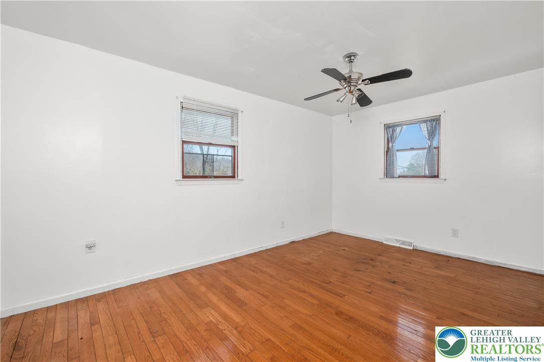 120 Royal Manor Road Easton, PA 18042 - Photo 22 of 49 a view of empty room with wooden floor