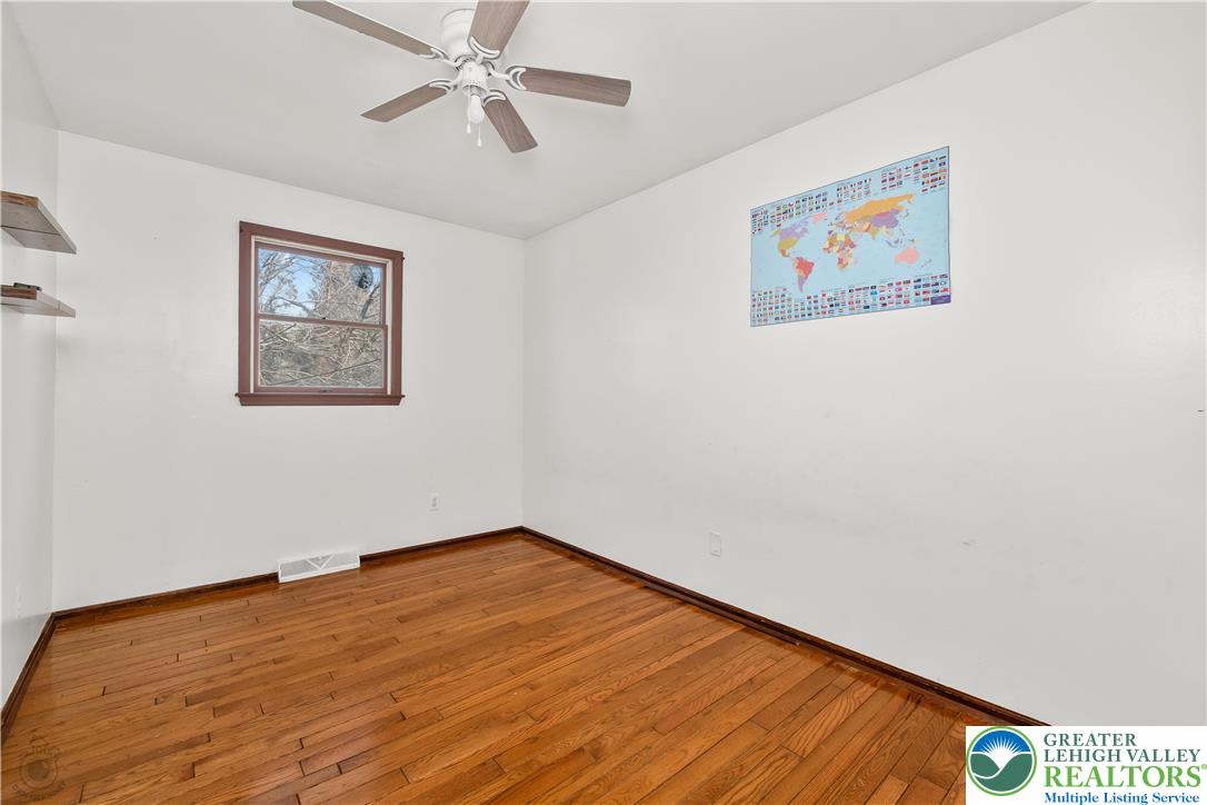 120 Royal Manor Road Easton, PA 18042 - Photo 23 of 49 a view of an empty room with wooden floor