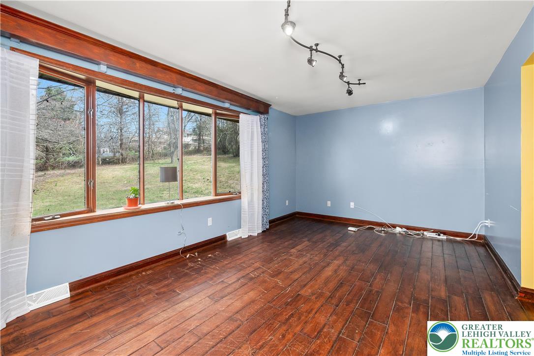 120 Royal Manor Road Easton, PA 18042 - Photo 6 of 49 a view of an empty room with wooden floor and a window