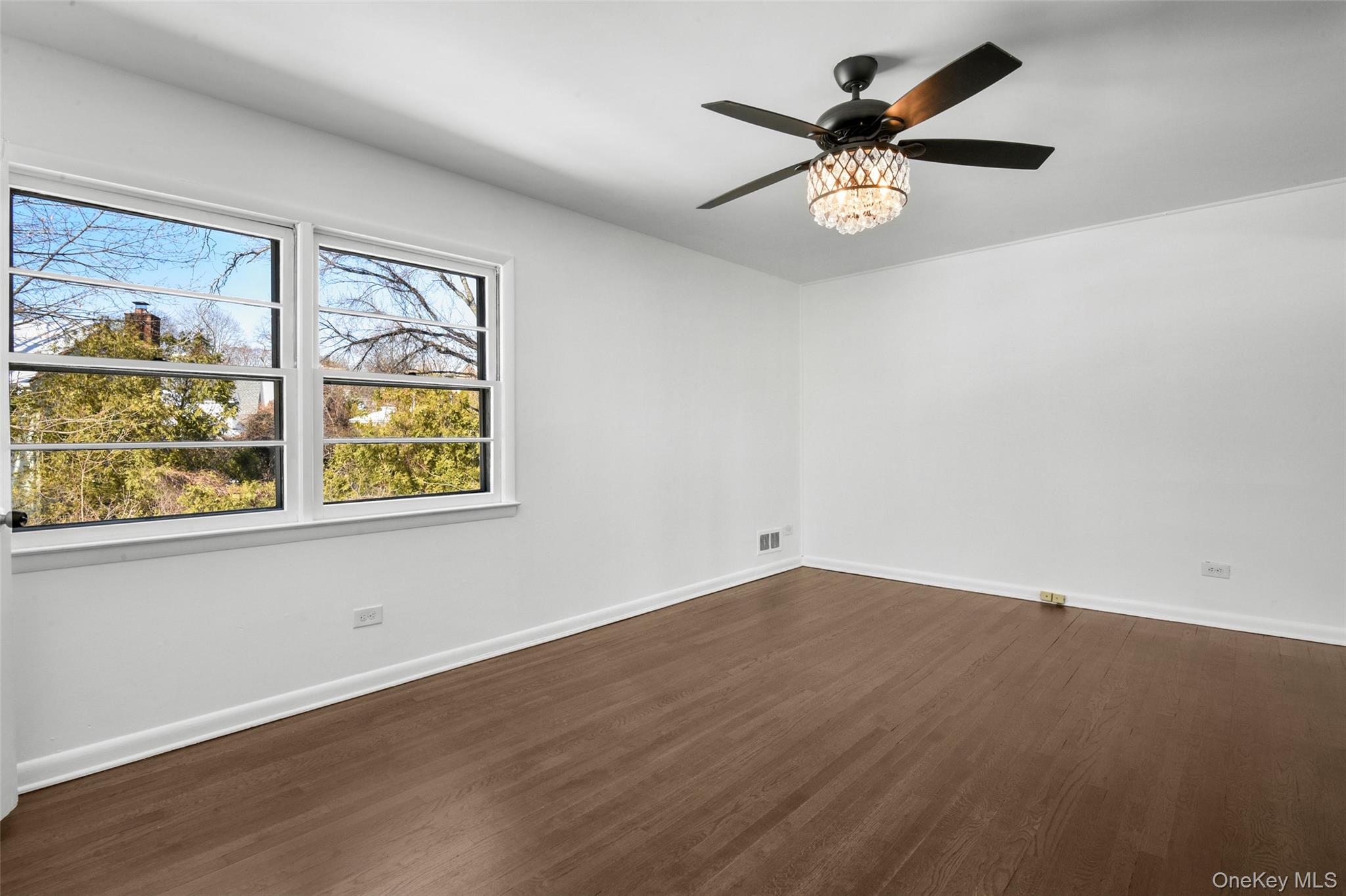46 Harding Drive New Rochelle, NY 10801 - Photo 15 of 31 an empty room with window and ceiling fan