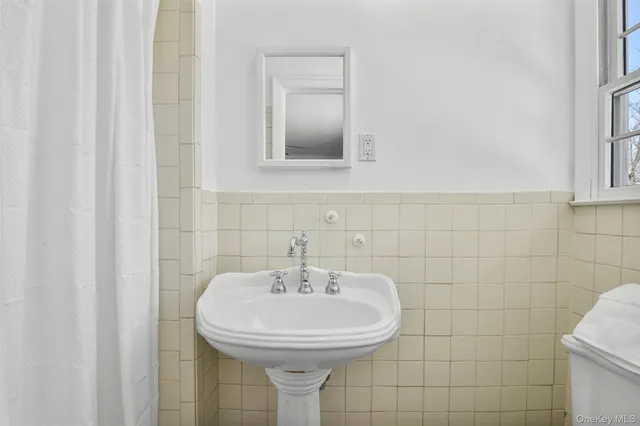 a bathroom with a sink a mirror and vanity