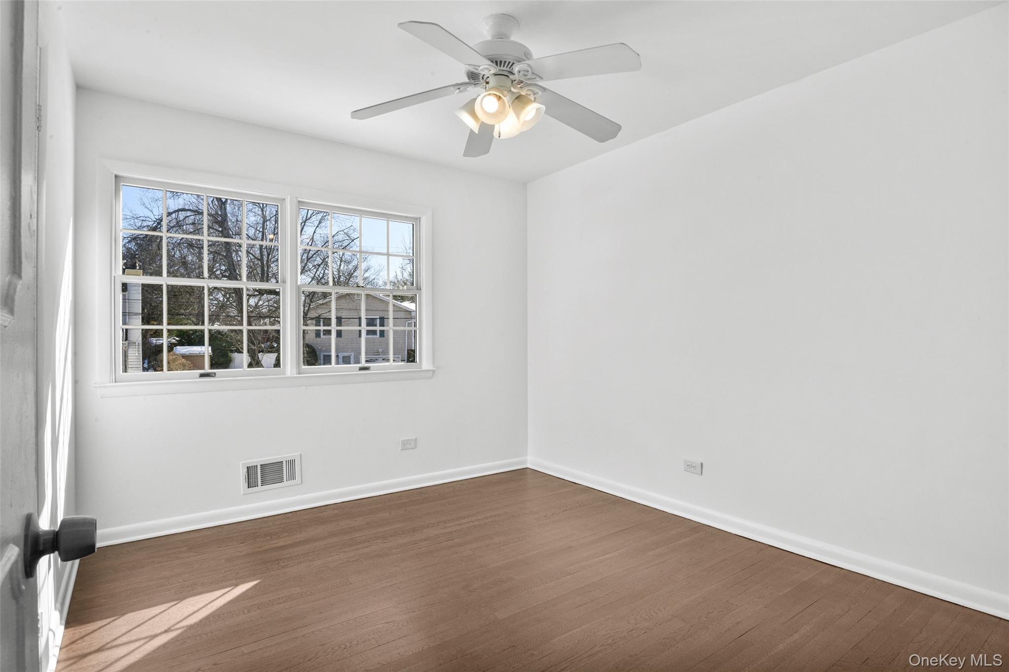 46 Harding Drive New Rochelle, NY 10801 - Photo 21 of 31 an empty room with a window and a fan