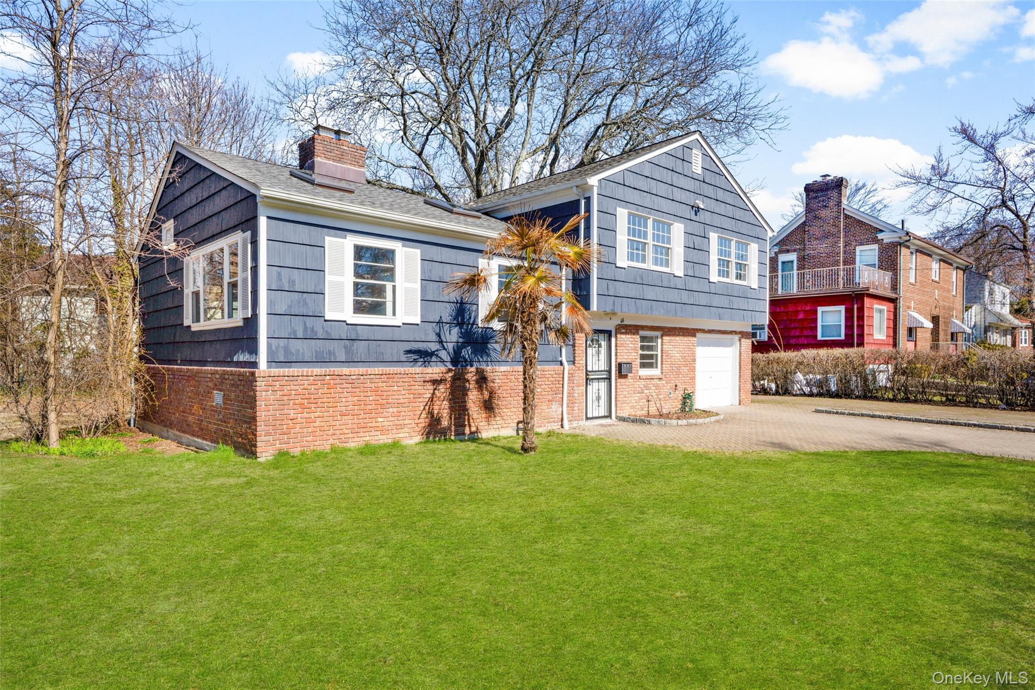 46 Harding Drive New Rochelle, NY 10801 - Photo 26 of 31 a view of a house with a yard and a large tree