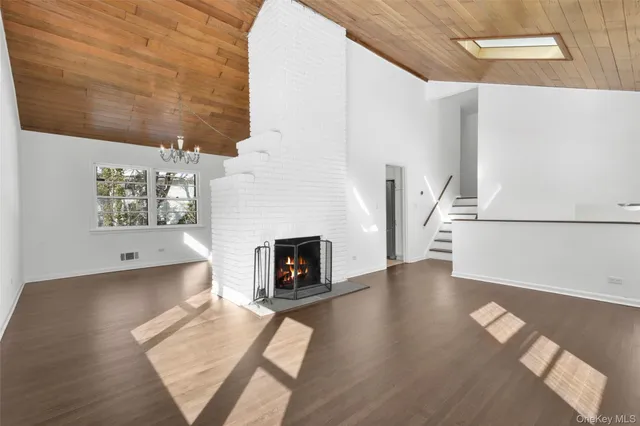 a view of a livingroom with furniture and a fireplace