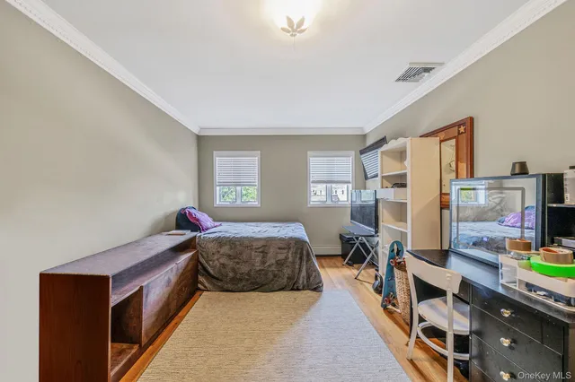 a bed room with a bed and a window