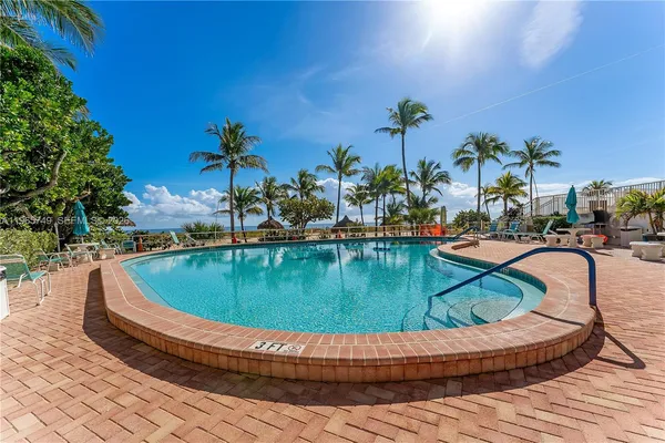 a view of swimming pool having outdoor seating