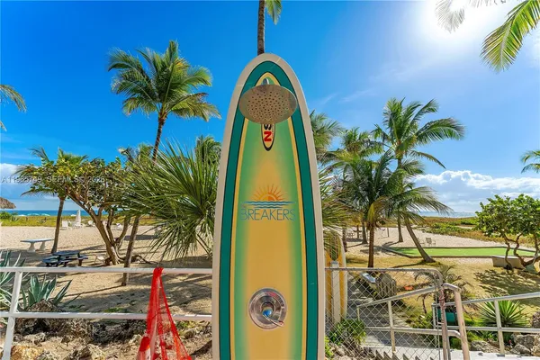 a view of swimming pool with a palm tree