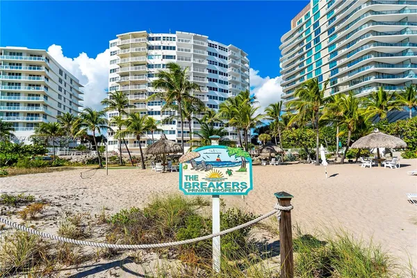 a front view of a building with garden