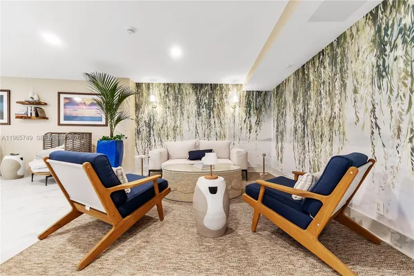 a living room with furniture and a rug