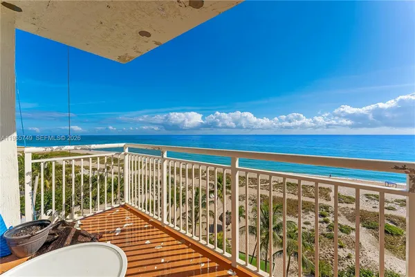 a view of balcony with furniture