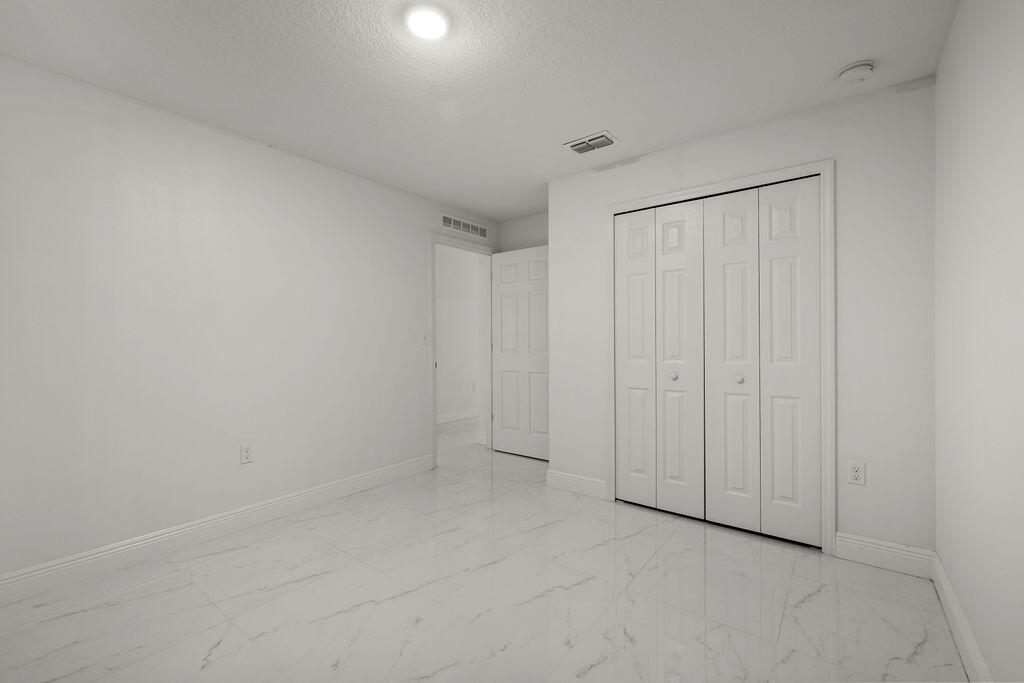 362 Northwest Bayshore Boulevard Port St. Lucie, FL 34983 - Photo 13 of 32 a view of an empty room