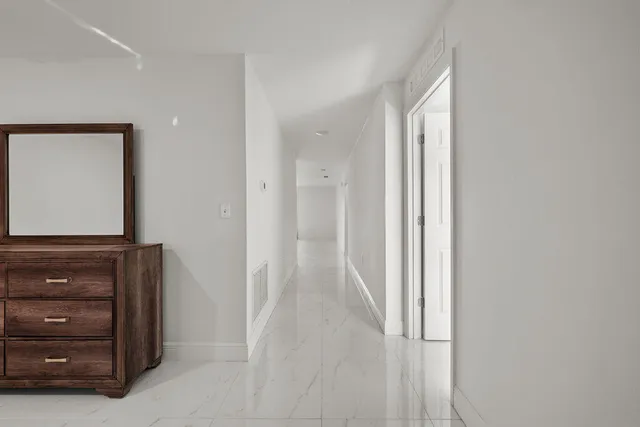 a view of a hallway with closet