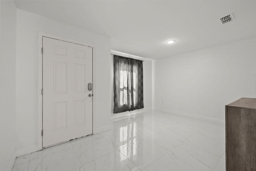 362 Northwest Bayshore Boulevard Port St. Lucie, FL 34983 - Photo 3 of 32 a view of an empty room