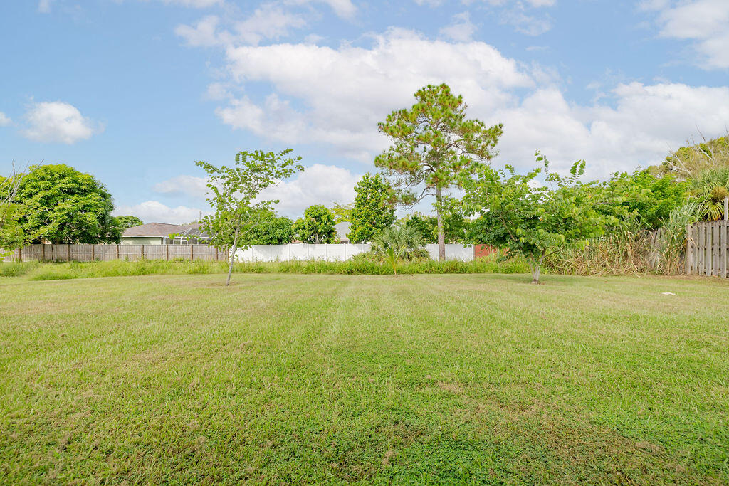 362 Northwest Bayshore Boulevard Port St. Lucie, FL 34983 - Photo 31 of 32 a view of yard with swimming pool and green space