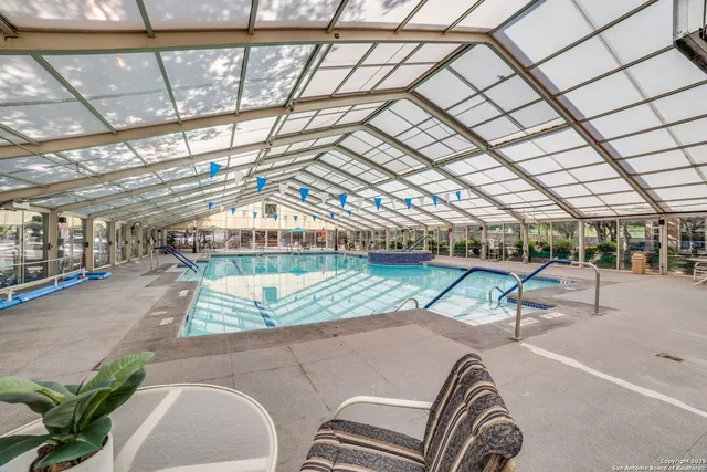 a view of a patio with a table and chairs