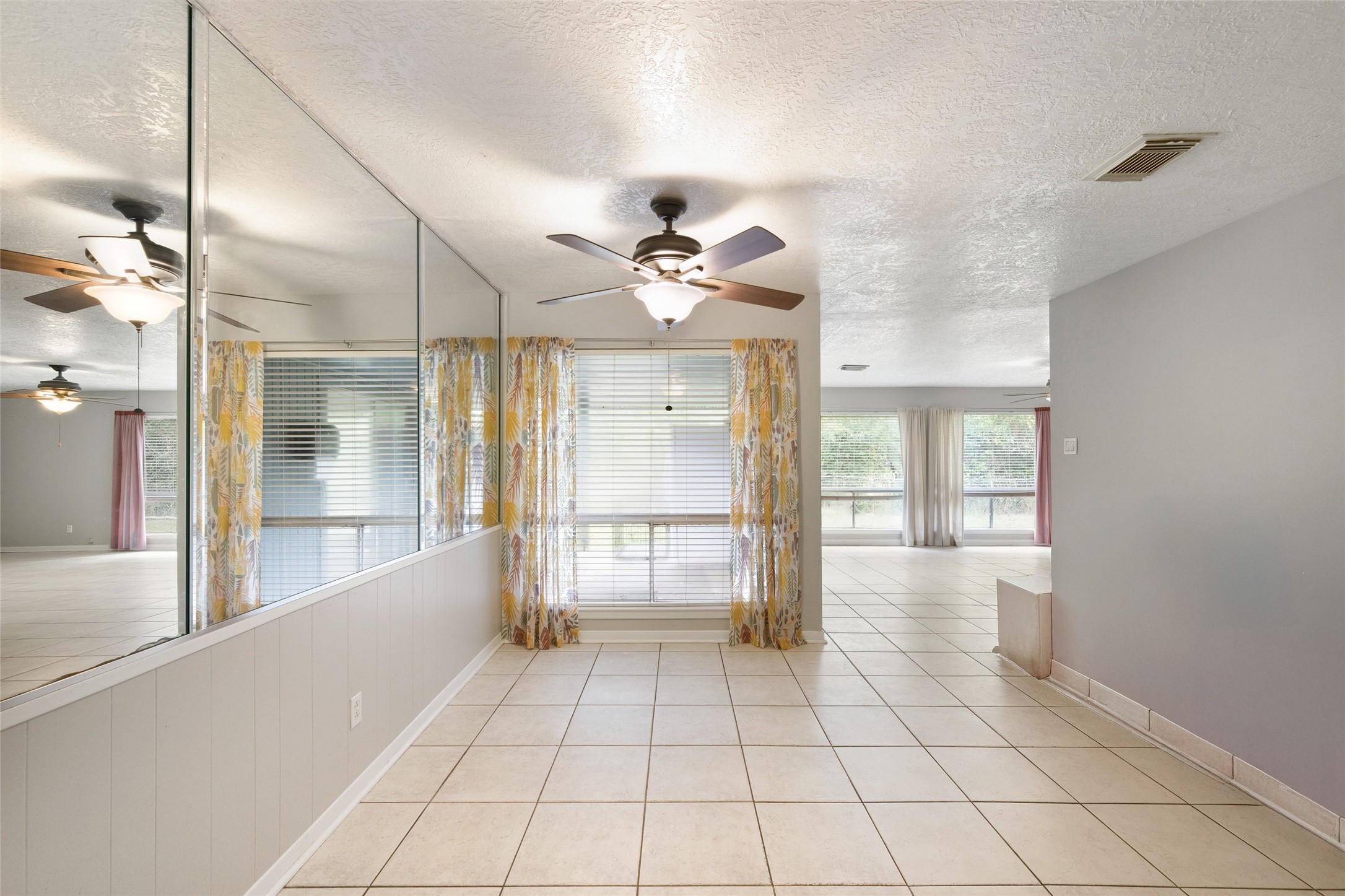 4205 Lariat Drive Baytown, TX 77521 - Photo 14 of 31 a view of an entryway with a chandelier fan