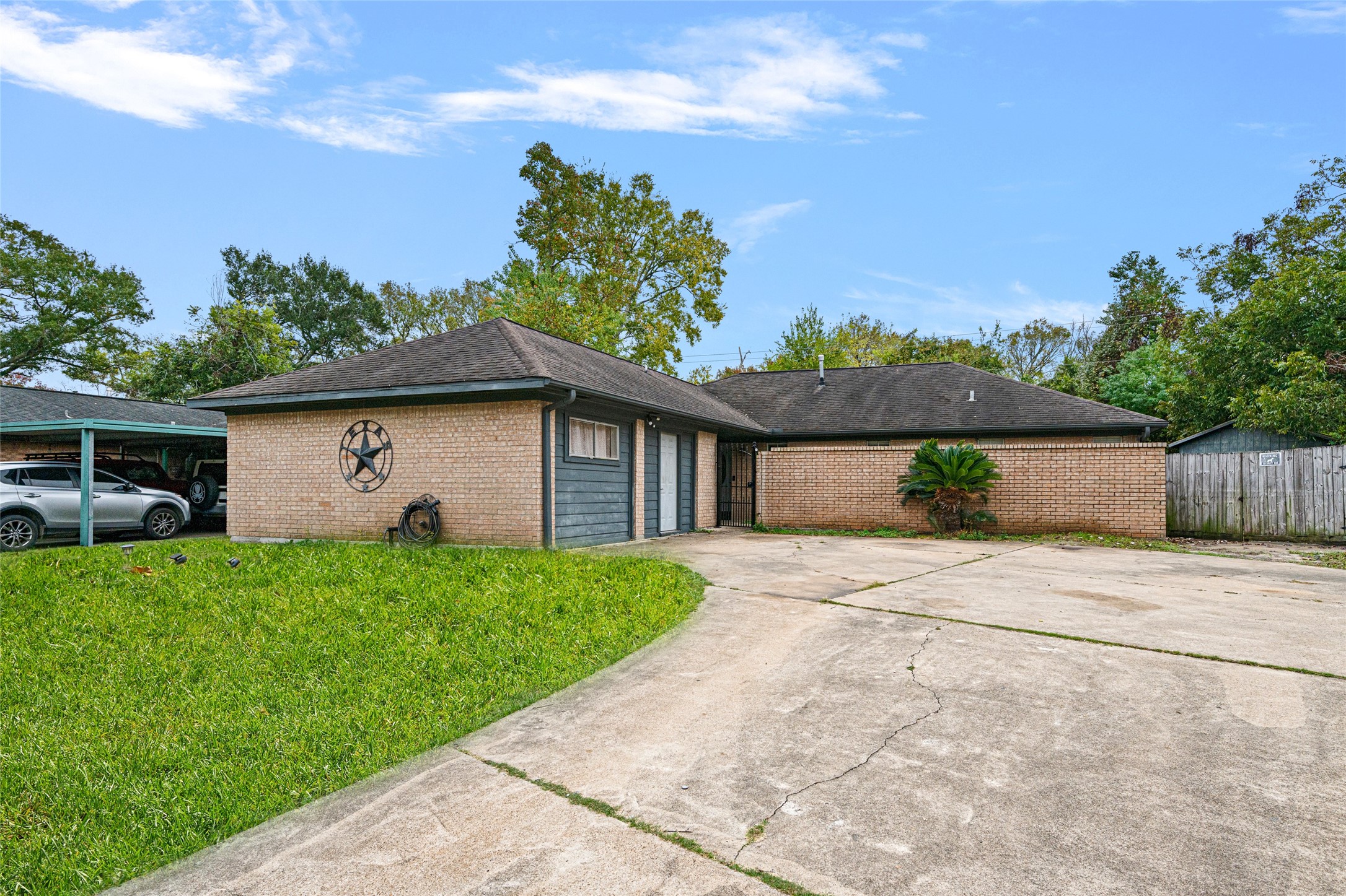 4205 Lariat Drive Baytown, TX 77521 - Photo 2 of 31 a view of backyard of house with green space