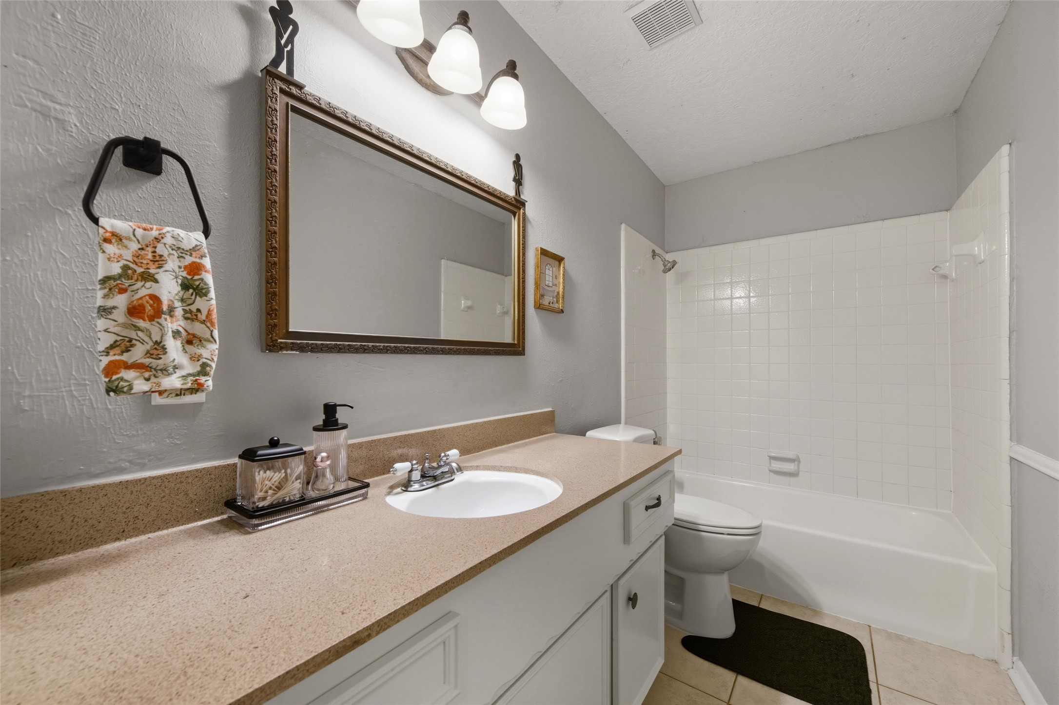 4205 Lariat Drive Baytown, TX 77521 - Photo 22 of 31 a bathroom with a sink vanity mirror and toilet